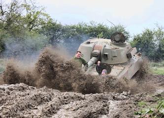 group of bucks riding in army tank