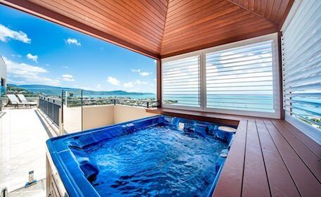 hot tub on balcony overlooking waterfront view Airlie Beach