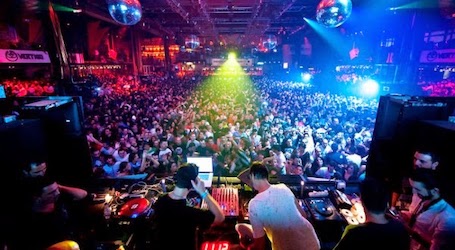 large crowd partying at nightclub