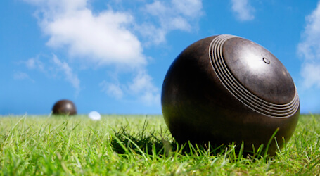 group of bucks playing lawn bowls