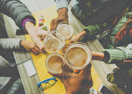 group of bucks cheering beers at cairns pub