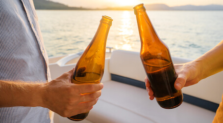 group of bucks drinking beer on boat cruise