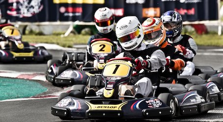 group of bucks racing on go kart track