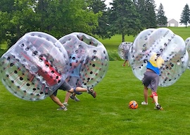 group of bucks playing bubble soccer