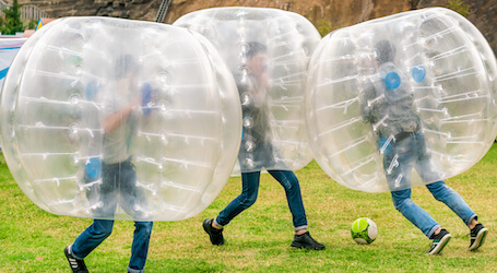 three bucks playing bubble soccer