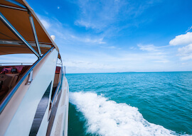 side view of luxury boat charter on the water