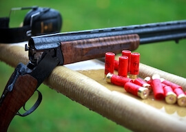 shotgun on bench with bullets