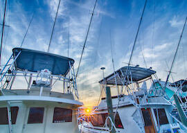 three fishing charter boats in the harbour