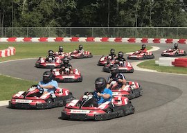 group of bucks tear around the go kart track