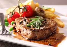 gourmet steak and chips with cherry tomoatos