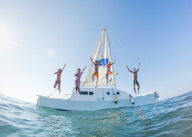 group of bucks jumping into water off private boat cruise