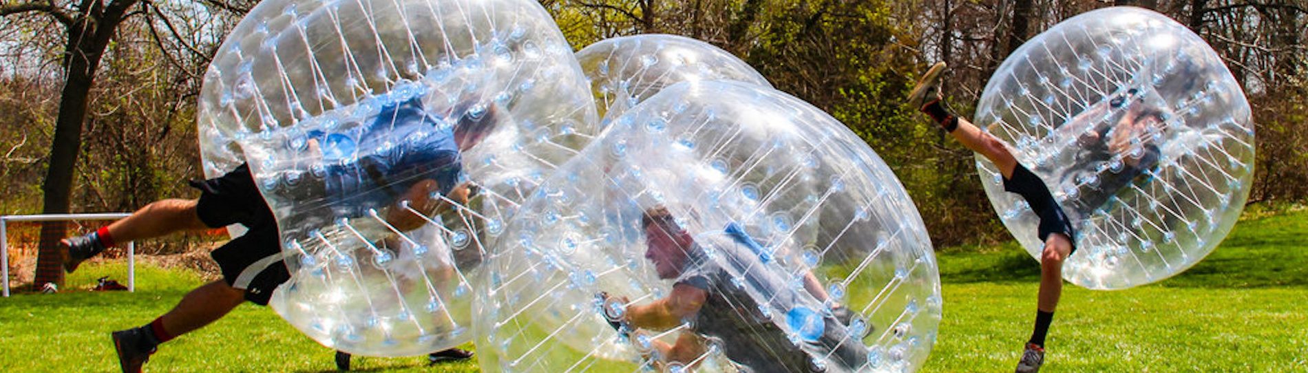 group of bucks playing bubble soccer