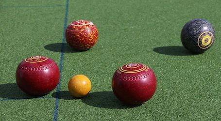 group of bucks playing lawn bowls