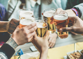 group of bucks cheersing beers