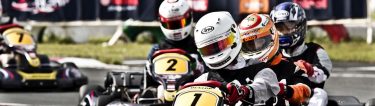 group of bucks competitively racing around go kart track