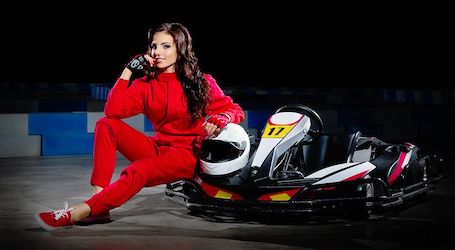 sexy go kart racing girl in red race suit