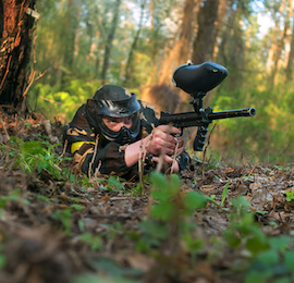 bucks on the paintball field lying down ready to shoot