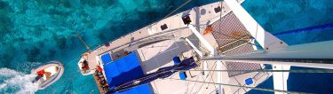 aerial view of yacht and dingy on the water