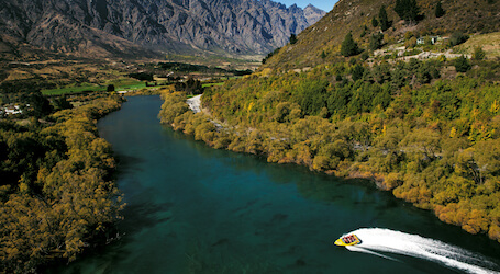 jet boat racing through queenstown river