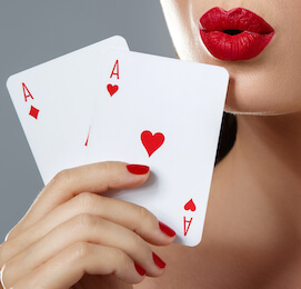 woman with red lipstick holding two cards