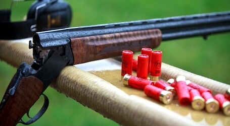 rifle and bullets on bench