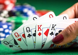 deck of cards in waitress hands on the poker table