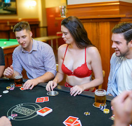 group of bucks playing poker with beautiful waitress