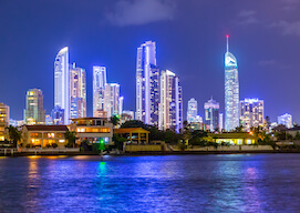 water view of Gold Coast at night with sky scrapers lit up