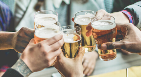 group of bucks cheering beers