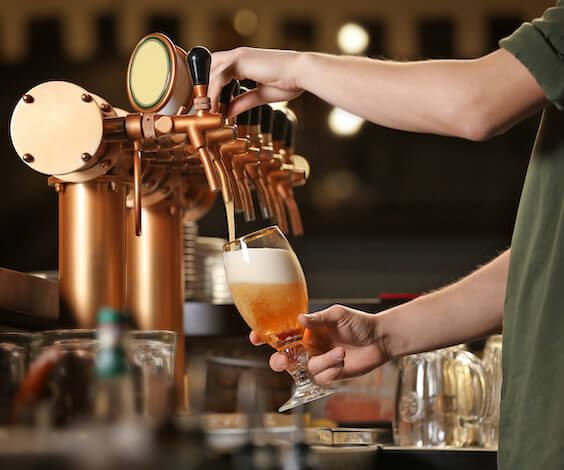 bartender pouring beer at Hobart brewery
