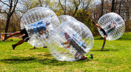 group of bucks playing bubble soccer