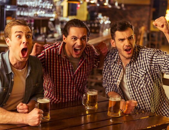 bucks cheering in bar with beers