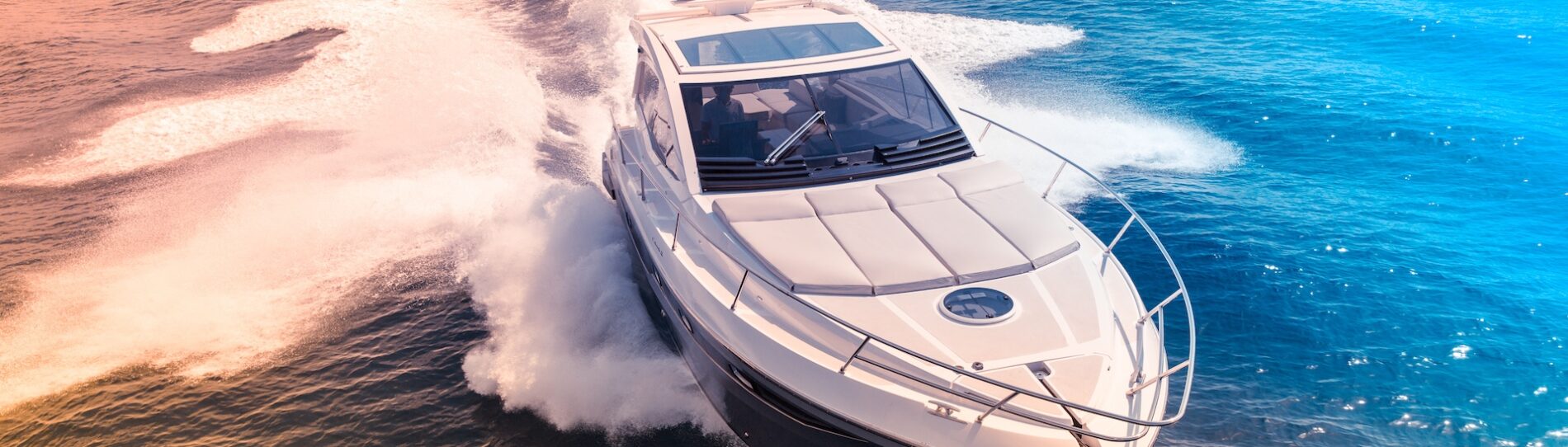 a speedboat races through the ocean