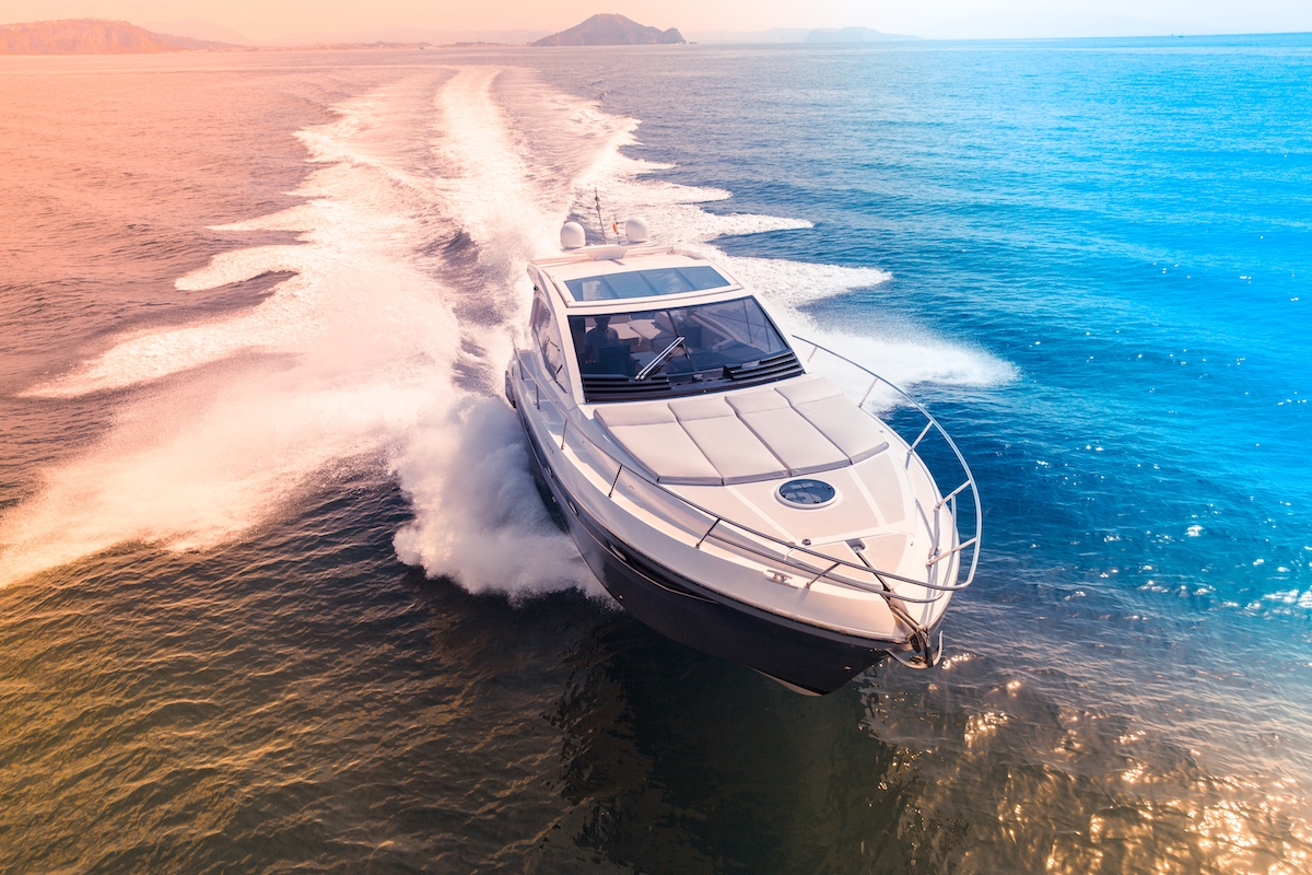 a speedboat races through the ocean