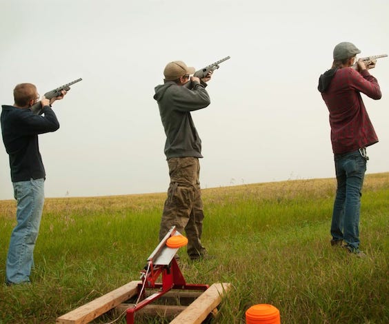 group of bucks shooting clay guns