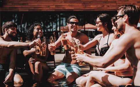 group of bucks drinking by pool