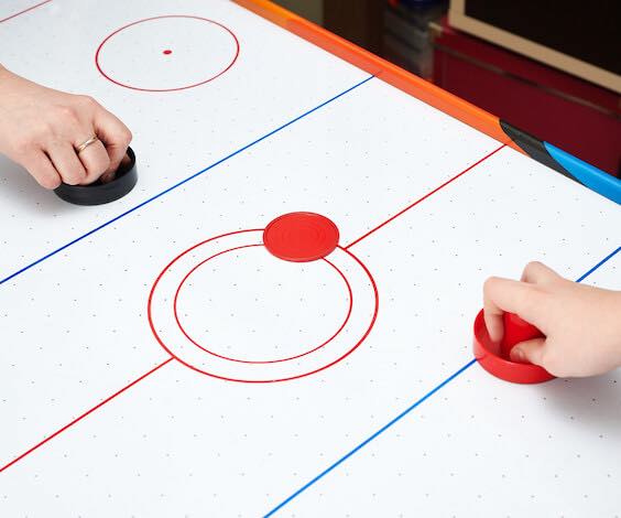 bucks playing air hockey