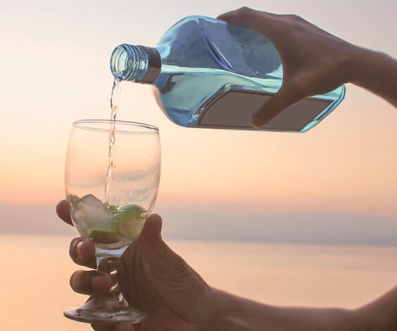 buck pouring gin into glass at a gin party in hobart