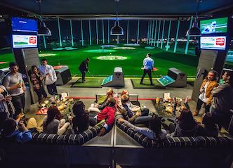 group of bucks playing golf at top golf
