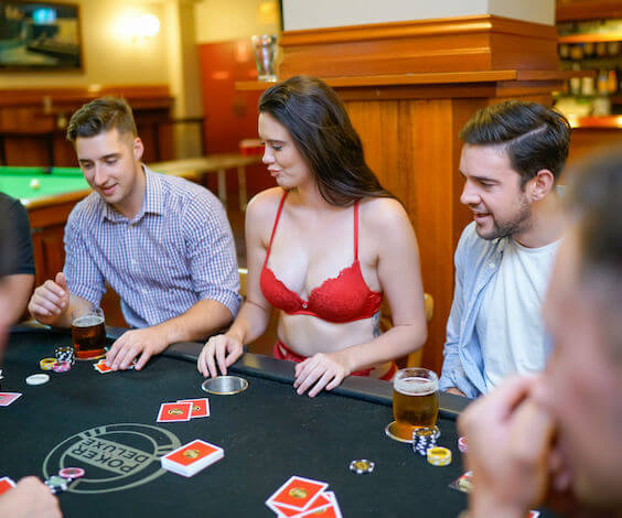 group of bucks playing poker with waitresses