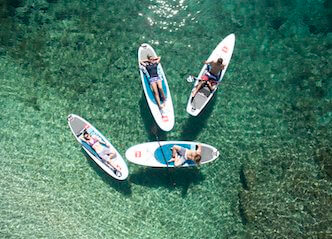 group of bucks stand up paddle boarding