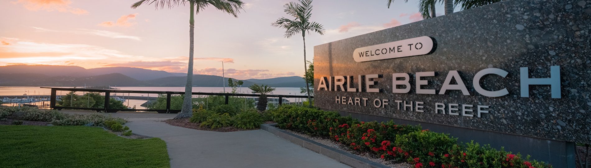 airlie beach entrance plaque welcome to airlie beach