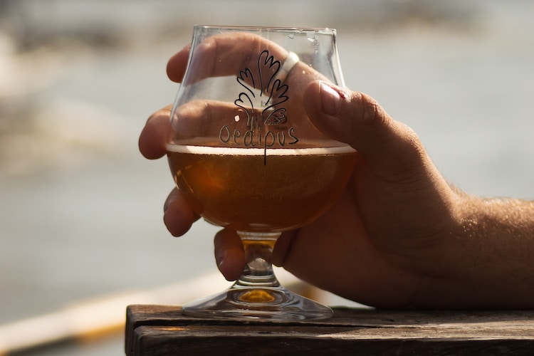 buck holding beer