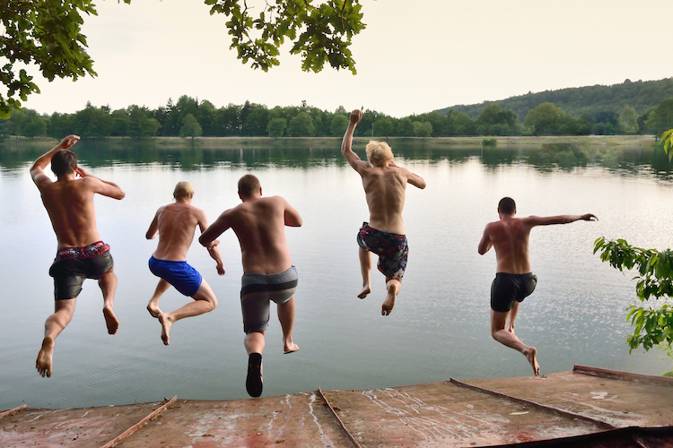 bucks group jumping in lake