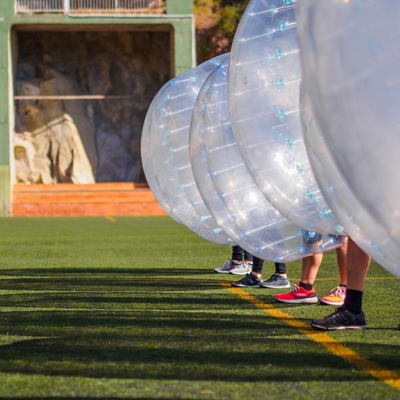 group of bucks playing bubble soccer