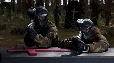 two people playing paintball